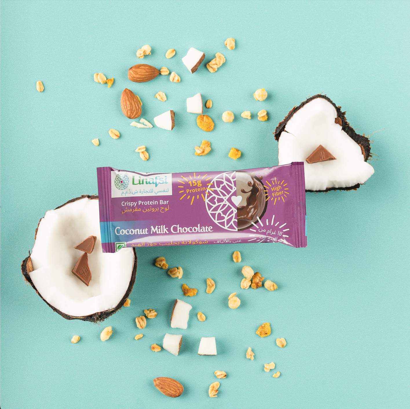 Linafsi - crispy protein bars - coconut milk chocolate - lifestyle image of bar placed on two coconut halves with ingredients milk chocolate, almonds and oats shown 